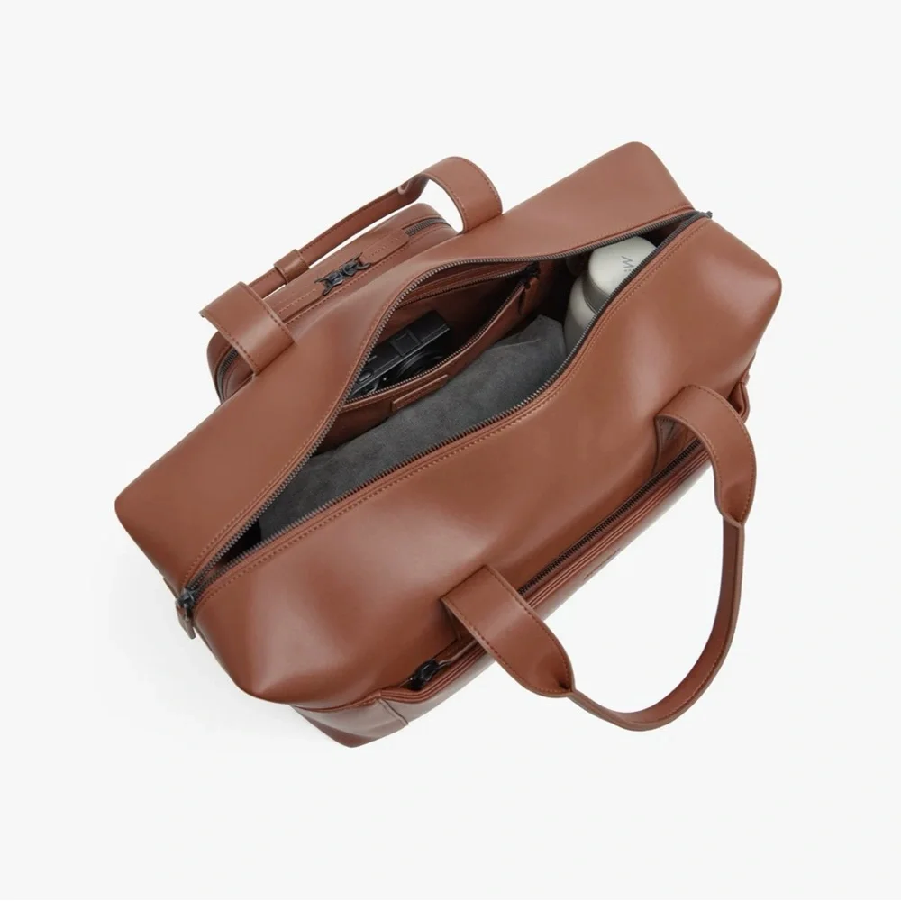NWOT Monos Metro Duffel in color Mahogany